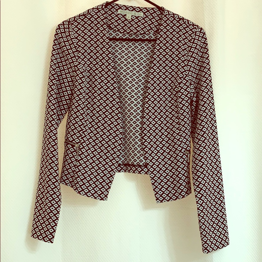 Cute black and white blazer.